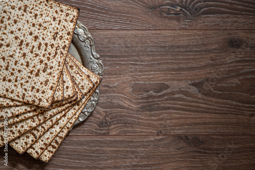 Pesach background. Passover Jewish. Matzah on the on the wood table Top view