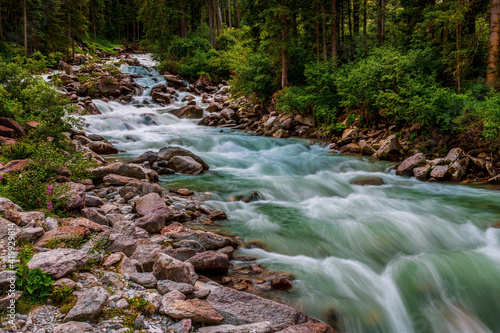 Fototapeta Naklejka Na Ścianę i Meble -  The river Krimmler Ache in the Hohe Tauern National Park in Austria. The Krimmler Ache forms the Krimmler waterfalls.