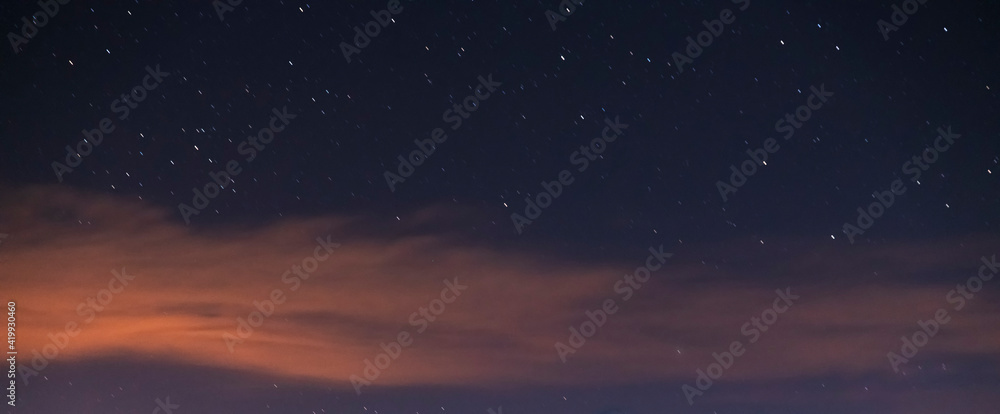 Starry sky with clouds. Night sky background.  