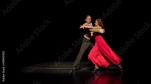 Pasodoble dance by ballroom dancing couple in spanish costumes on the stage photo