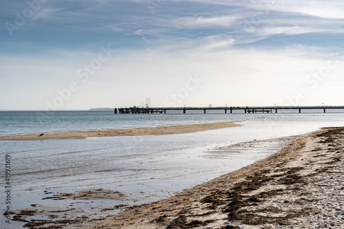 pier on the baltic sea on a sandy beach wadden sea