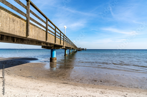 pier on the baltic sea on a sandy beach