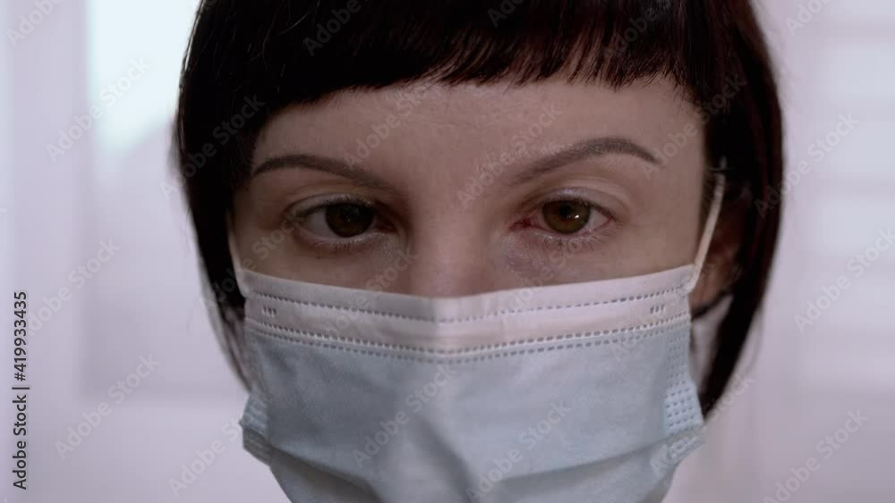 Young Girl in Mask Rotates Red, Bloodshot Eyes. Viral Conjunctivitis. 4K Young Girl in Mask Rotates Red, Bloodshot Eyes. Viral Conjunctivitis. 4K