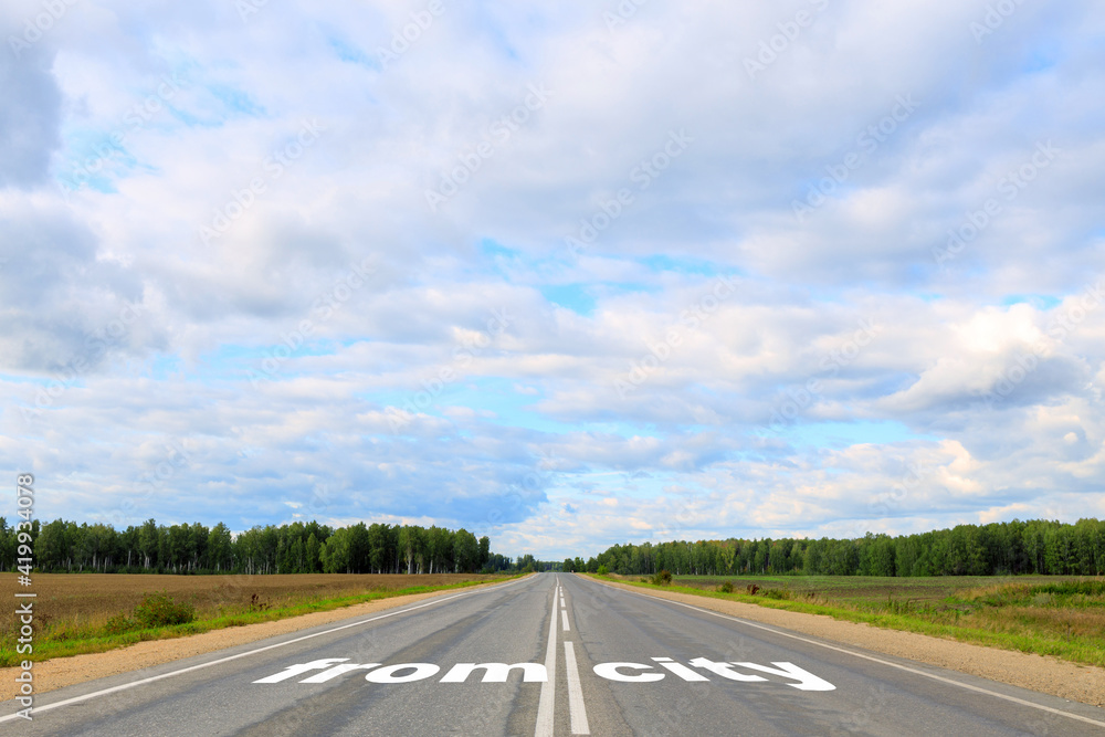 out of the city is written on the asphalt