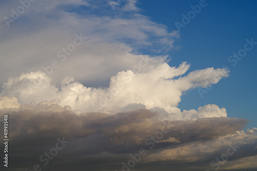 Cloudscape background taken in Southern California showing three layers of clouds with different colors and texture.