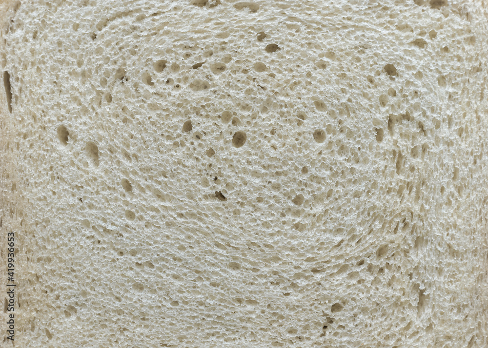Close up texture of a slice of white bread, background. Close up texture of a slice of white bread, background.
