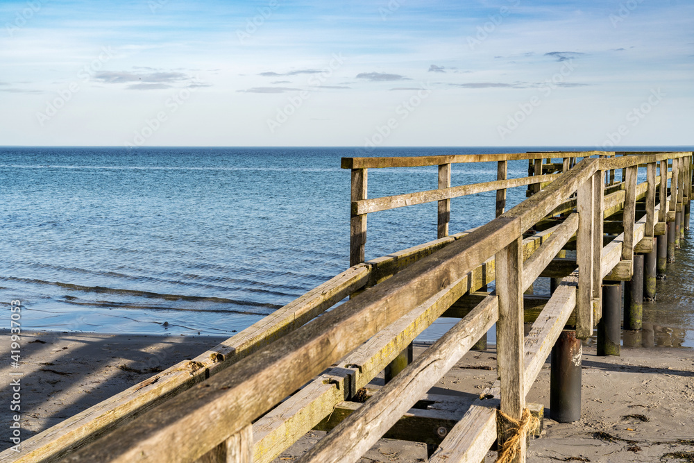 pier on the baltic sea on a sandy beach