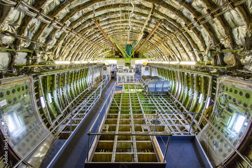 Inside view of a dismantled widebody airplane fuselage  photo
