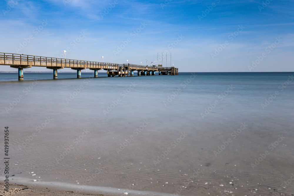 pier on the baltic sea on a sandy beach