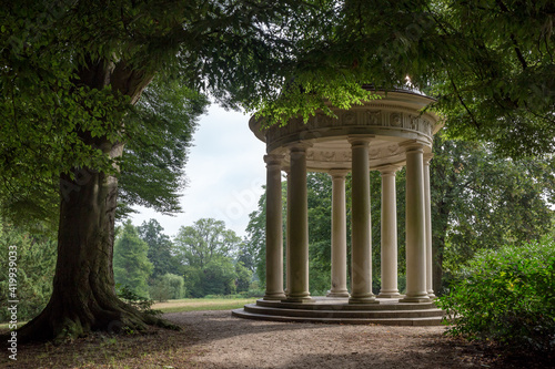 Round Pavilion with Coloums between Trees in Park, Europe