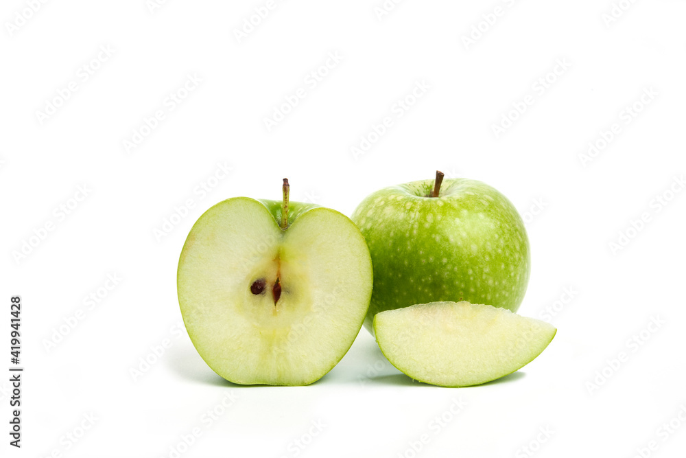 Whole and sliced green apples isolated on white background Whole and sliced green apples isolated on white background