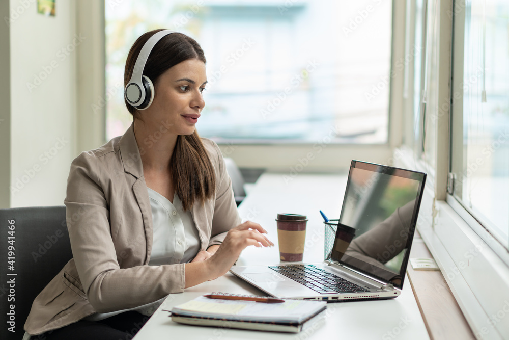 young woman in online meeting in the office. . young woman in online meeting in the office. .