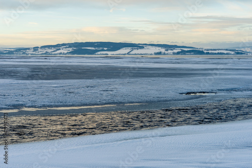 Lenaelva River flowing into Lake Mjøsa at winter. © Øyvind