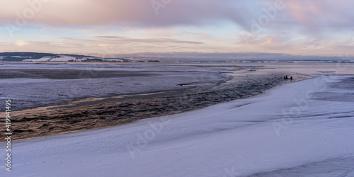 Lenaelva River flowing into Lake Mj  sa at winter.