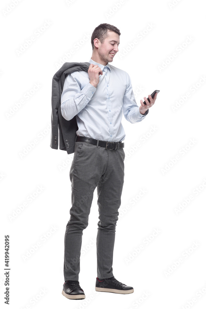 in full growth. smiling business man with a smartphone . in full growth. smiling business man with a smartphone .