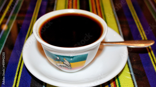 Selective focus on fresh organic homemade coffee cup, The ancient traditional Ethiopian coffee ceremony, Ethiopian restaurant in Phnom Penh, Cambodia