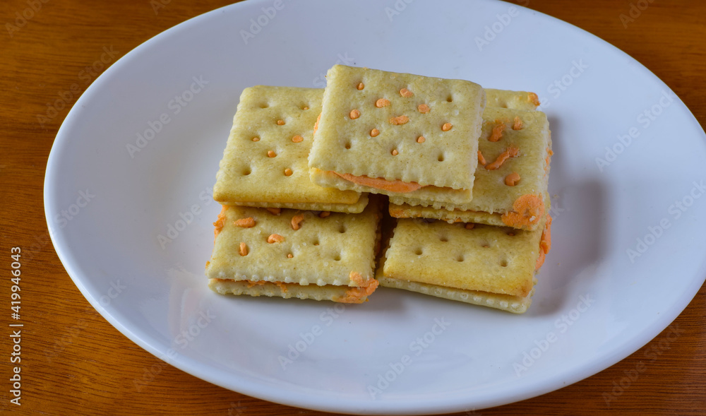 cheese crackers arranged on a small plate,