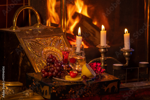 Fireplace, candles and romantic still life