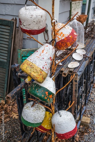 USA, Massachusetts, Cape Ann, Essex. Antique lobster buoys. photo