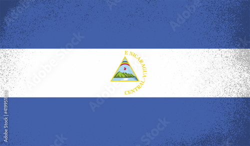 Grunge Nicaragua flag. Nicaragua flag with waving grunge texture. Vector background.