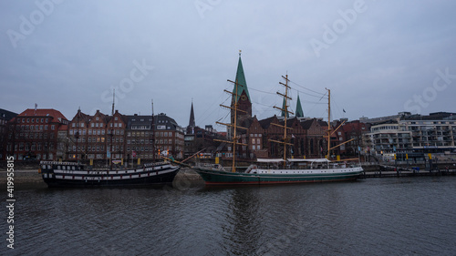 view of the old town bremen with sailboat 