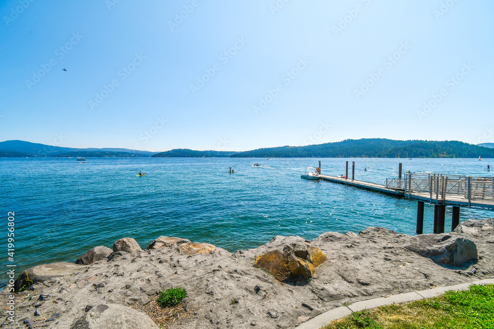 A small boat launch and dock near City Park and Beach at the lake in Coeur d'Alene, Idaho, USA.