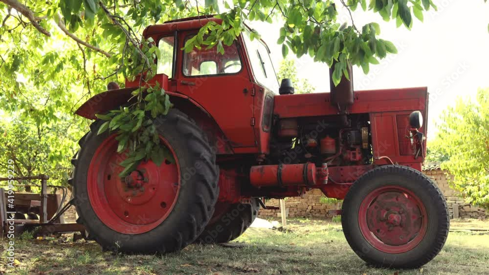 Tractor in a farmland. Horticulture concept Tractor in a farmland. Horticulture concept