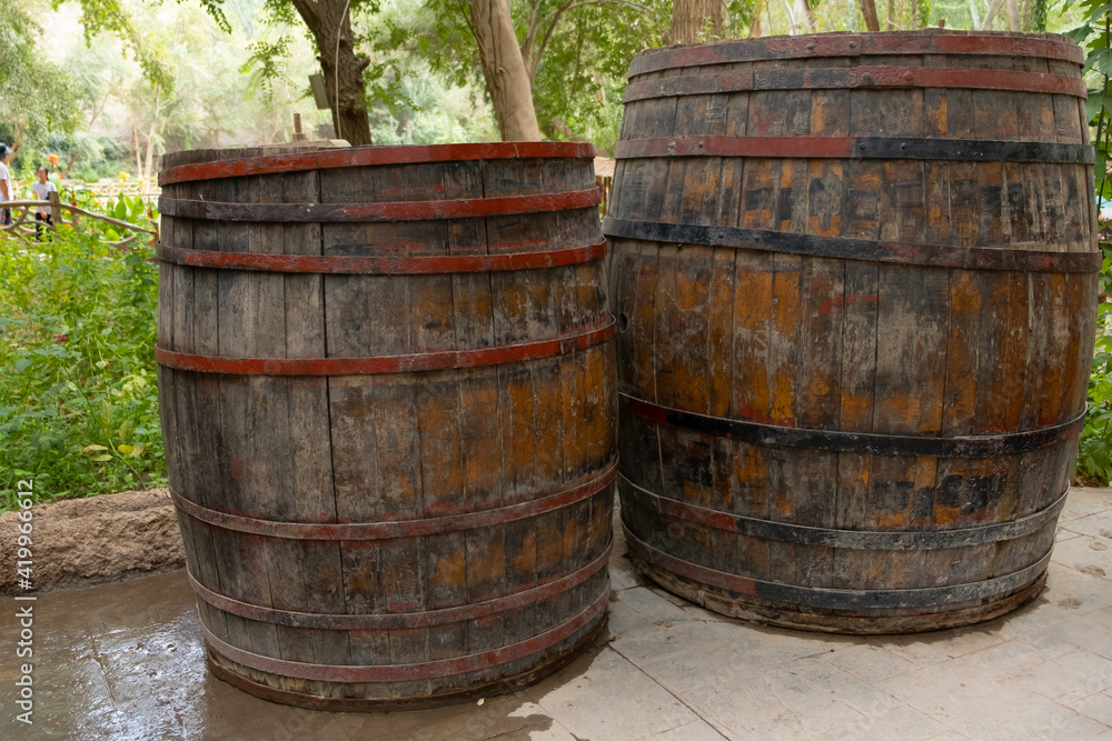 Big volume wooden wine barrels in the park Big volume wooden wine barrels in the park
