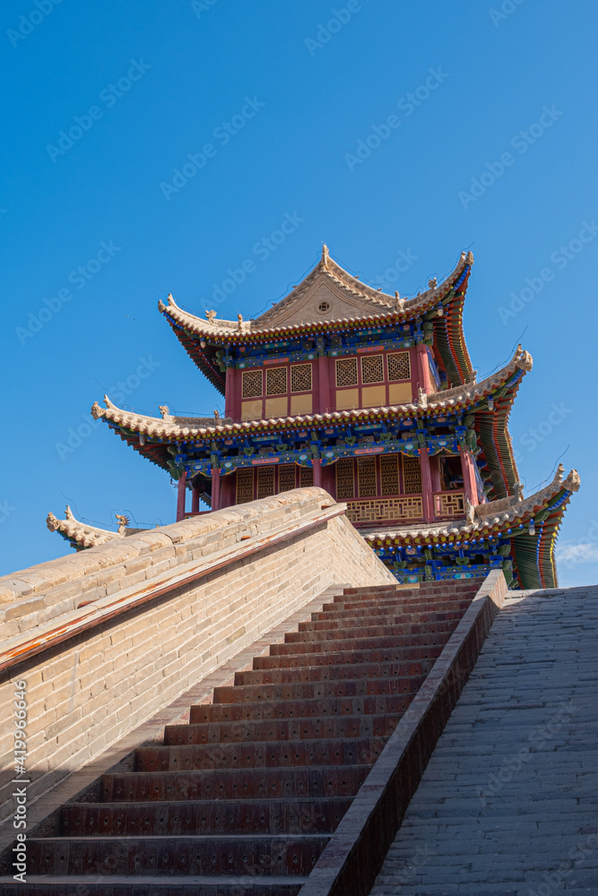 Stairs on the wall of jiayuguan great wall pass with tower Stairs on the wall of jiayuguan great wall pass with tower