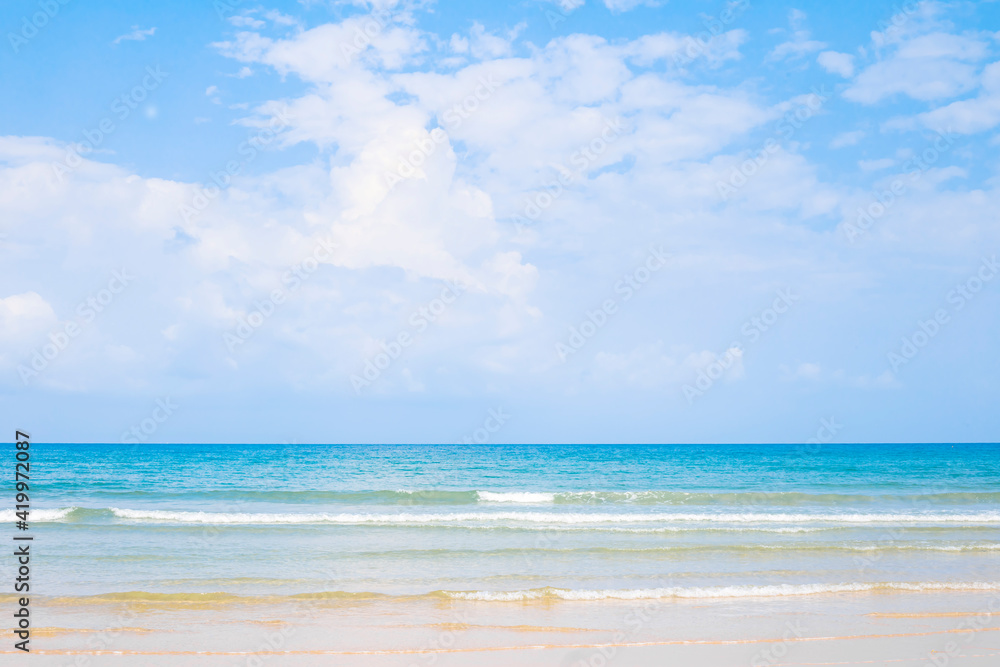 Beautiful clean beach in south of Thailand, and small wave from blue sea under clear blue sky in a sunny day