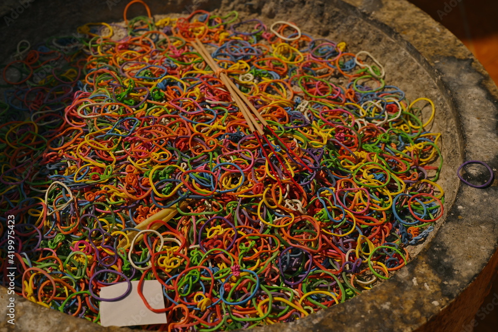 Voorouder jas vier keer A multicolored rubber band was stripped of the cauldron after straining  incense and candles used to worship monks in temples. The concept of  recycling to save the world Stock Photo | Adobe