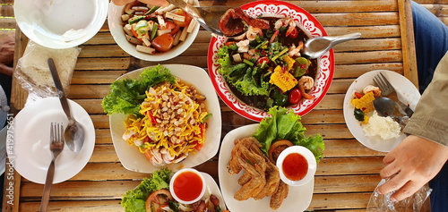 Canvas Print The top view of sitting around and eating spicy Northeastern food Contains papay