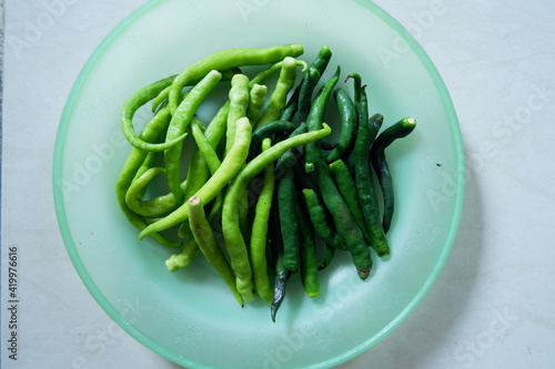 a plate of green chilies 