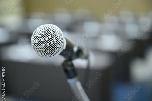 Microphone over the blurred business people forum Meeting Conference Training Learning Coaching Concept, Blurred background.