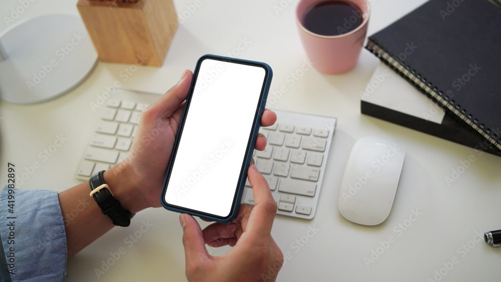 Close up view of businessman using smart phone . Blank screen for advertising text. Close up view of businessman using smart phone . Blank screen for advertising text.