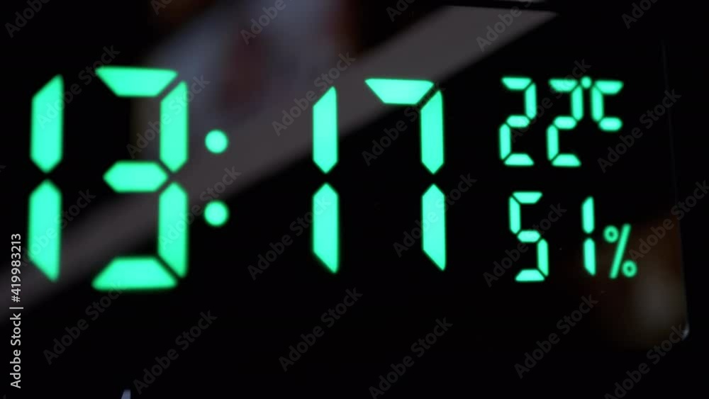 Time on Electronic Clock. Green Dial with Shimmering Neon Lighting. Led Watch. 4K Time on Electronic Clock. Green Dial with Shimmering Neon Lighting. Led Watch. 4K