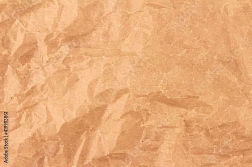 Background from brown crumpled paper. Crumpled paper background