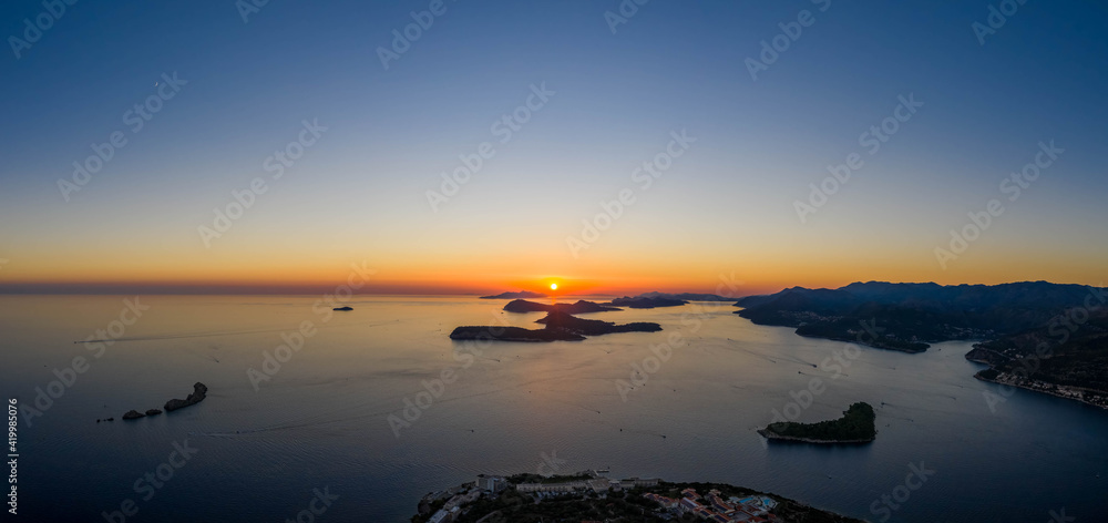Aerial panorama drone shot of sunset horizon in Adriatic islands in Dubrovnik in Croatia summer