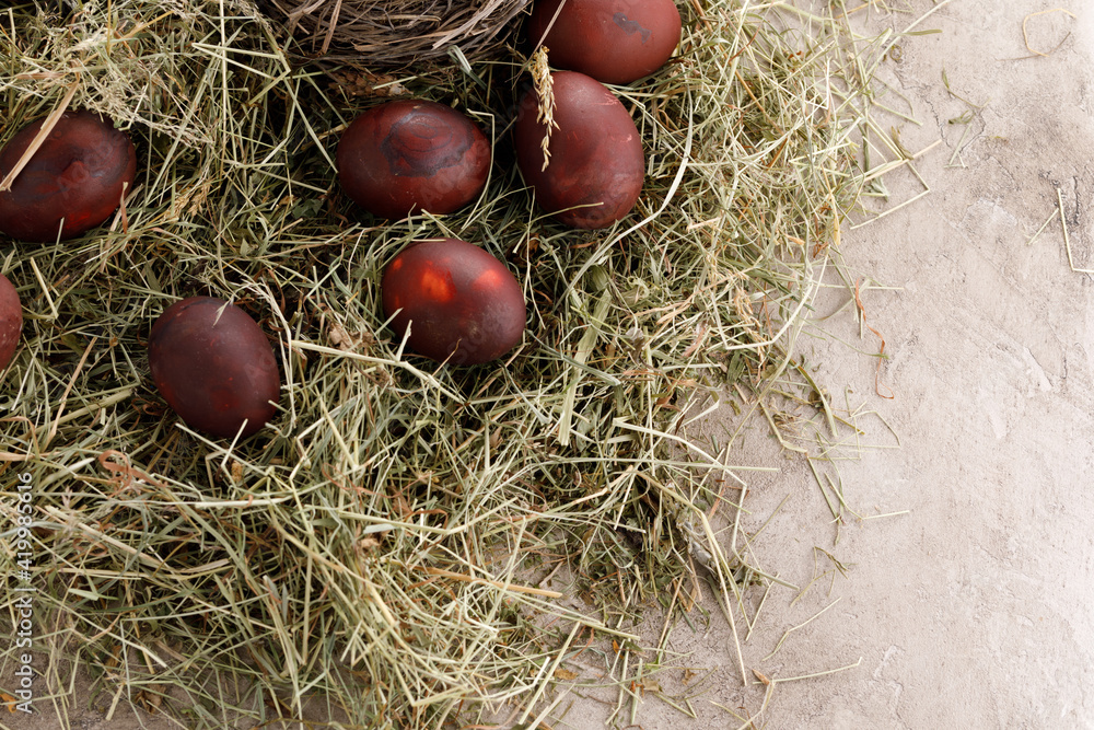 Still life many colorful easter eggs on a textural background. Rustic. Decoration from natural herbs. Easter celebration concept. Still life many colorful easter eggs on a textural background. Rustic. Decoration from natural herbs. Easter celebration concept.