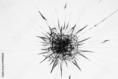 Broken glass protection screen of smartphone. Cracked black glass on a white background.