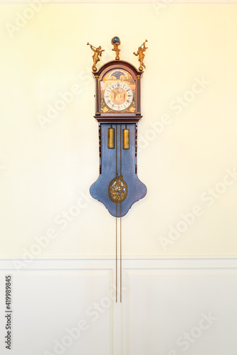 Vintage wall clock on the classic wall style