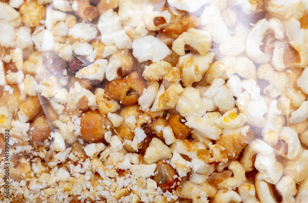 Popcorn in a plastic bag as a background. Popcorn in a plastic bag as a background.