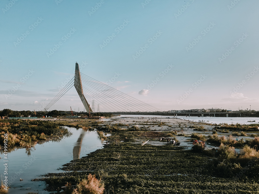 Obraz premium Signature Bridge is a cantilever spar cable-stayed bridge which spans the Yamuna river at Wazirabad section, connecting Wazirabad to East Delhi.