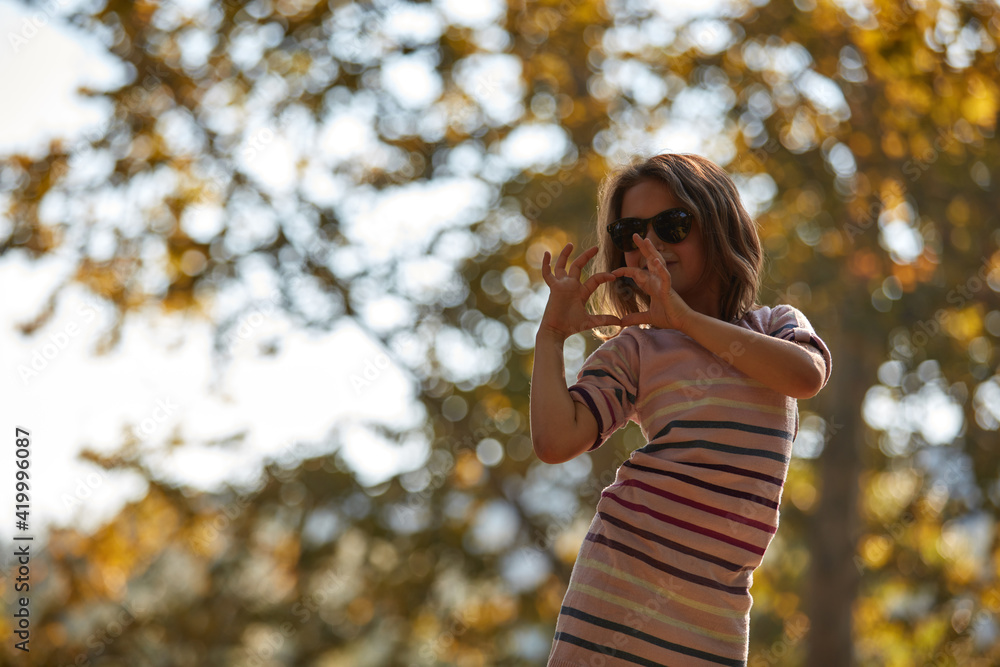 Child girl enjoying outdoors nature in the park. Child girl enjoying outdoors nature in the park.