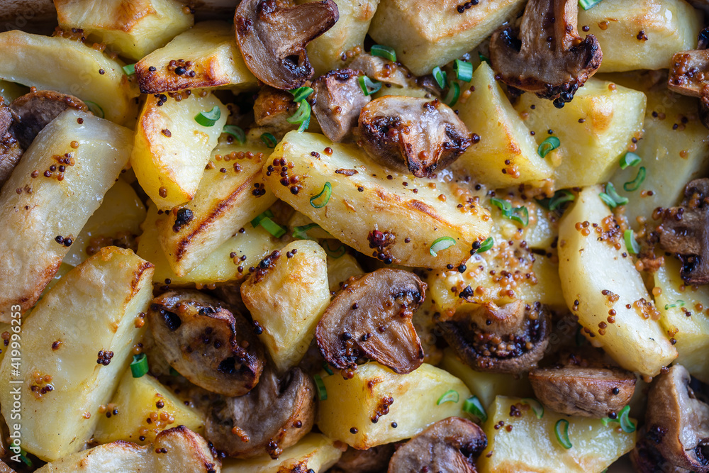 Baked potatoes with mushrooms in Dijon mustard sauce and olive oil Baked potatoes with mushrooms in Dijon mustard sauce and olive oil