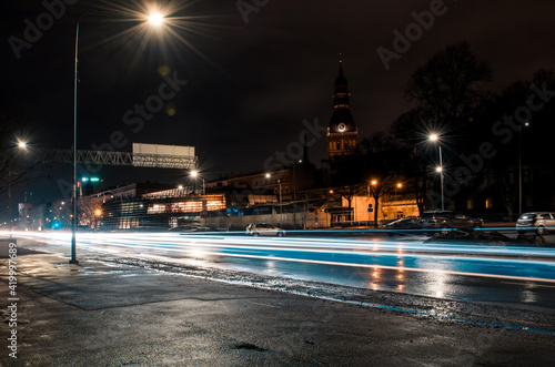 Long exposure photo at night. Light trails on the road