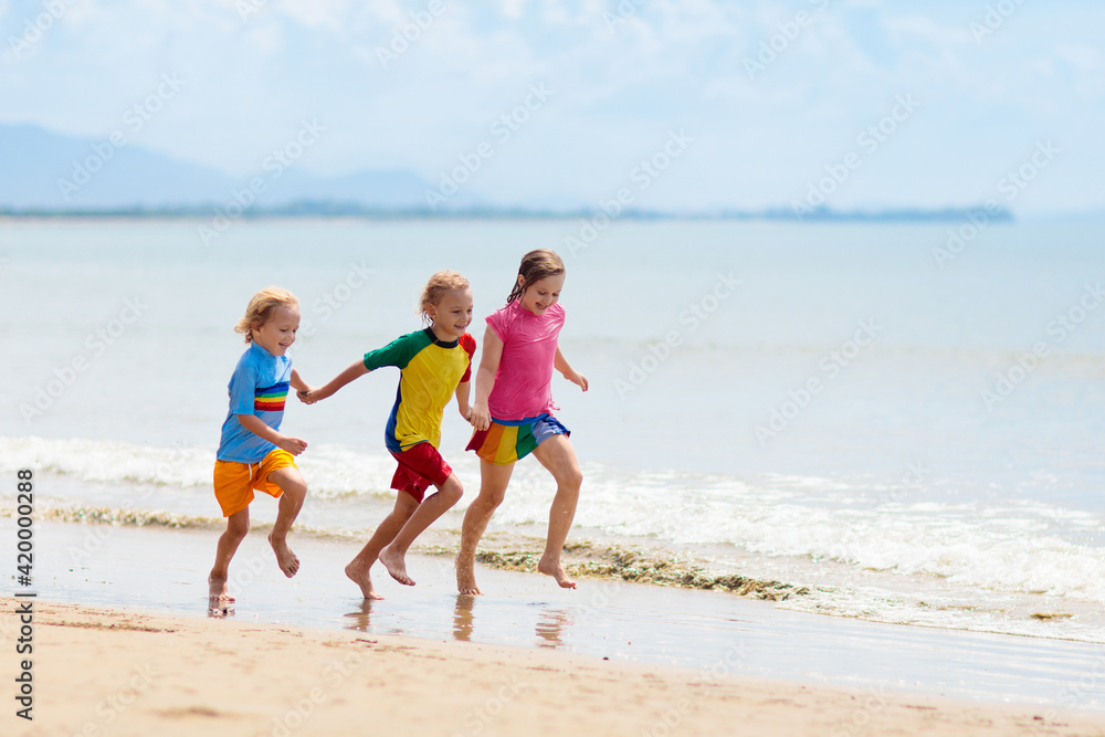 Kids playing on beach. Children play at sea. Kids playing on beach. Children play at sea.