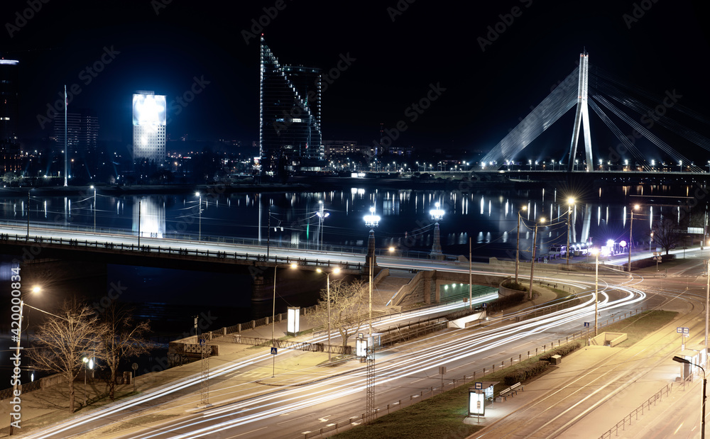 Night view of the bridge over the Daugava river