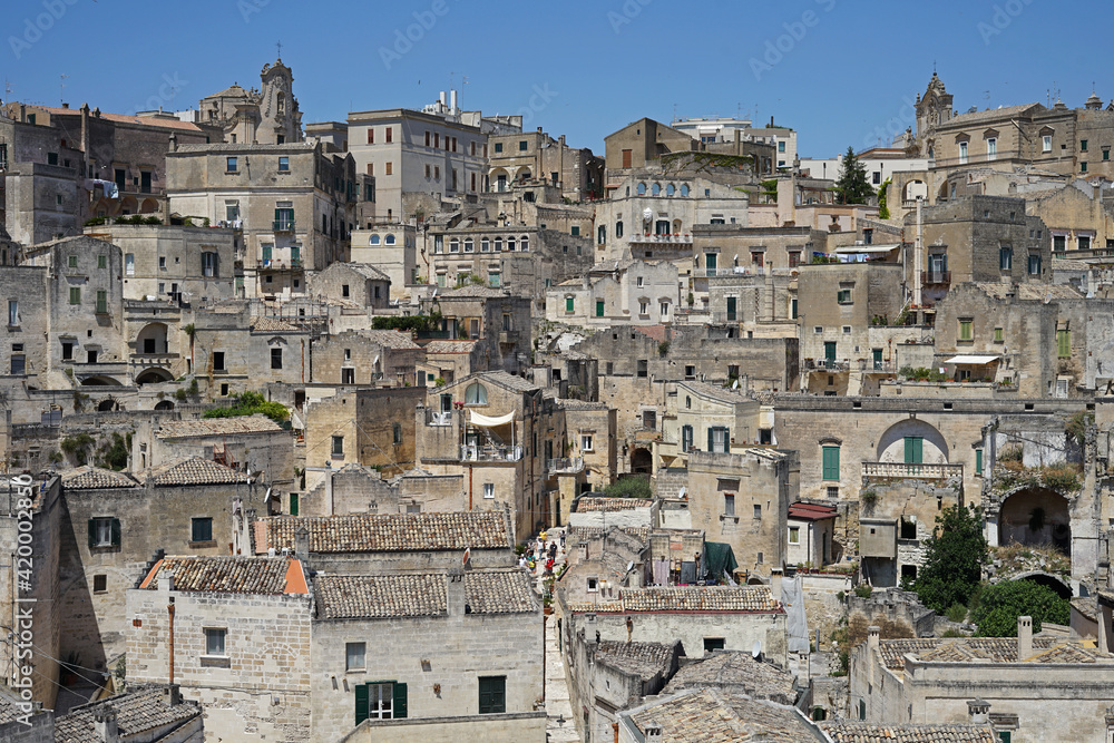 Matera historic site aerial cityscape with church, popular tourist travel place, guided tour concept, Basilicata, Italy