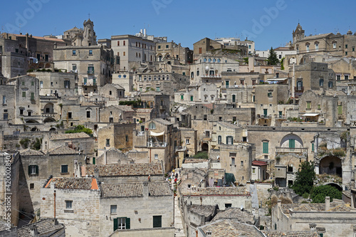 Matera historic site aerial cityscape with church, popular tourist travel place, guided tour concept, Basilicata, Italy